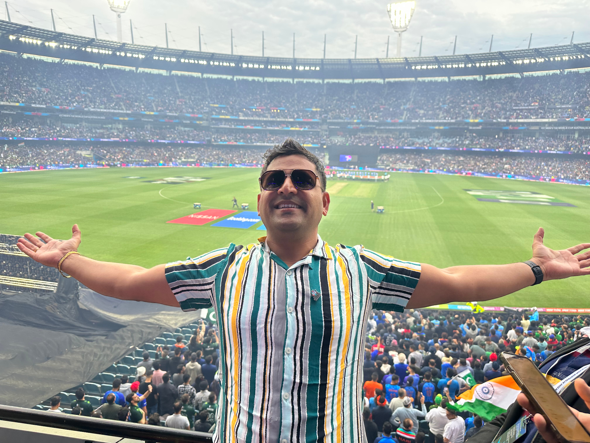 Veeresh KB celebrating at a packed stadium